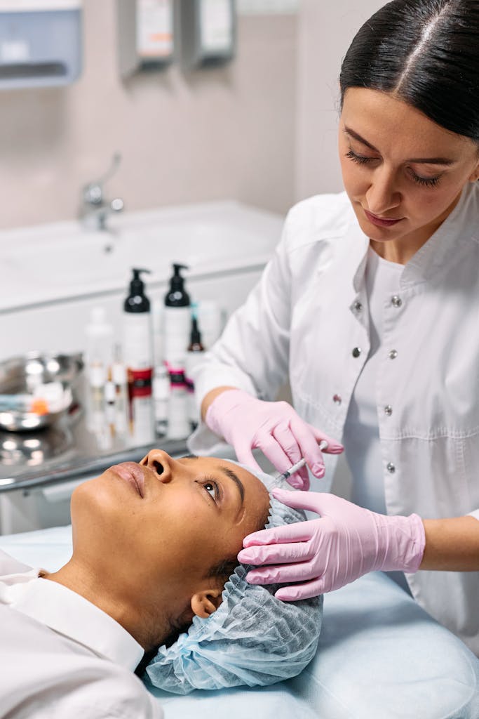 Professional skincare treatment with a dermatologist in a clinical setting.